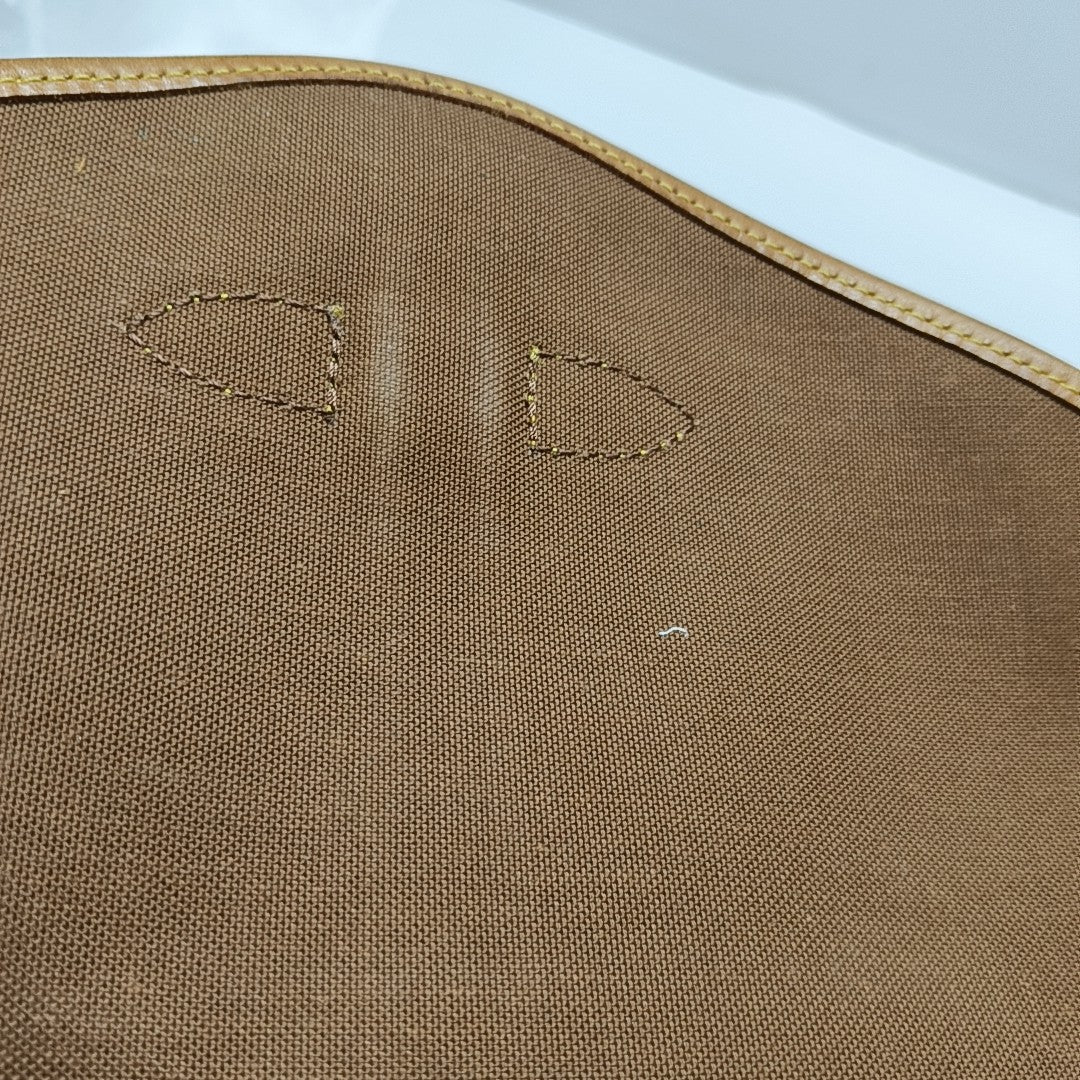 SAUMUR Monogram Coated Canvas Brown