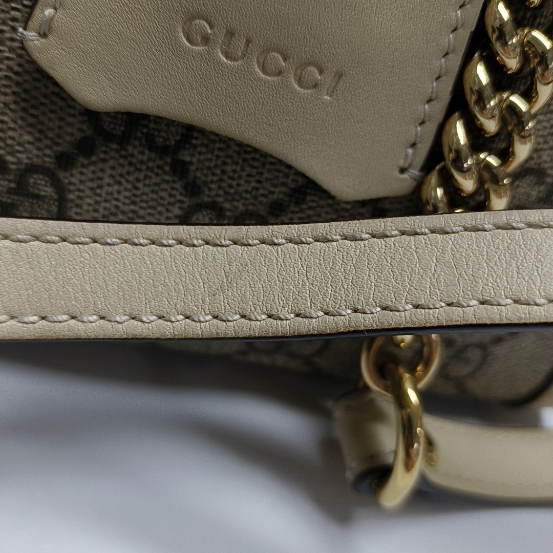 Padlock Small Monogram Coated Canvas Beige