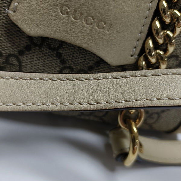 Padlock Small Monogram Coated Canvas Beige