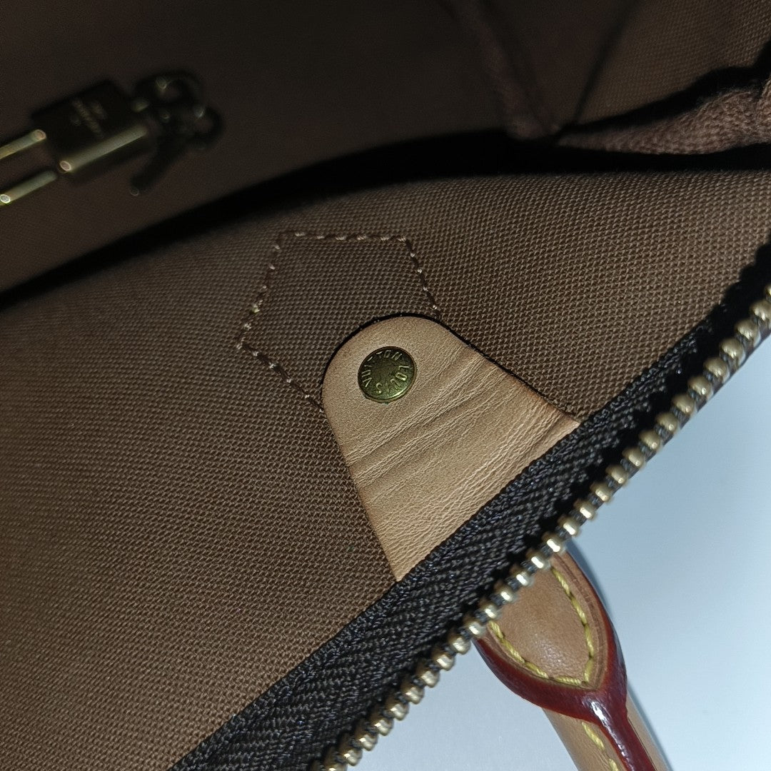 SPEEDY 25 Monogram Coated Canvas Brown