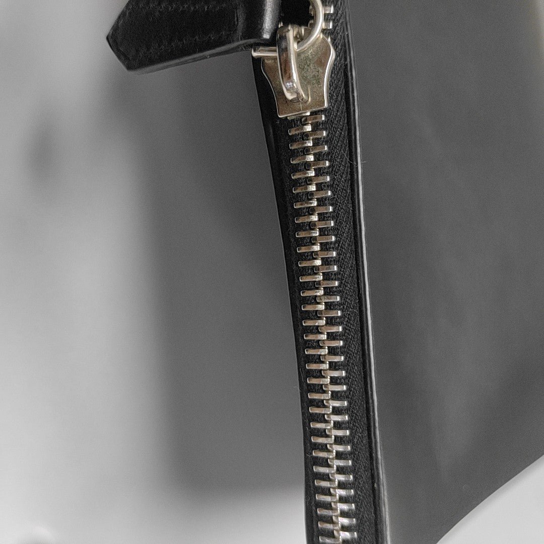 Authenticated pre-owned  Monster Calfskin Black - Clutch at Looply