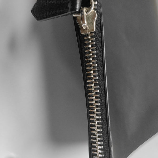 Authenticated pre-owned  Monster Calfskin Black - Clutch at Looply