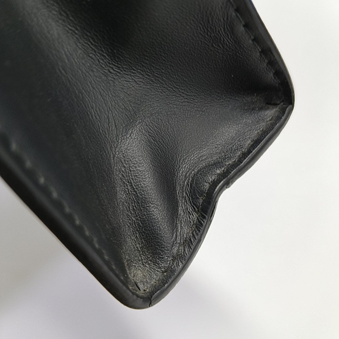 Pochette Voyag MM Monogram Coated Canvas Black