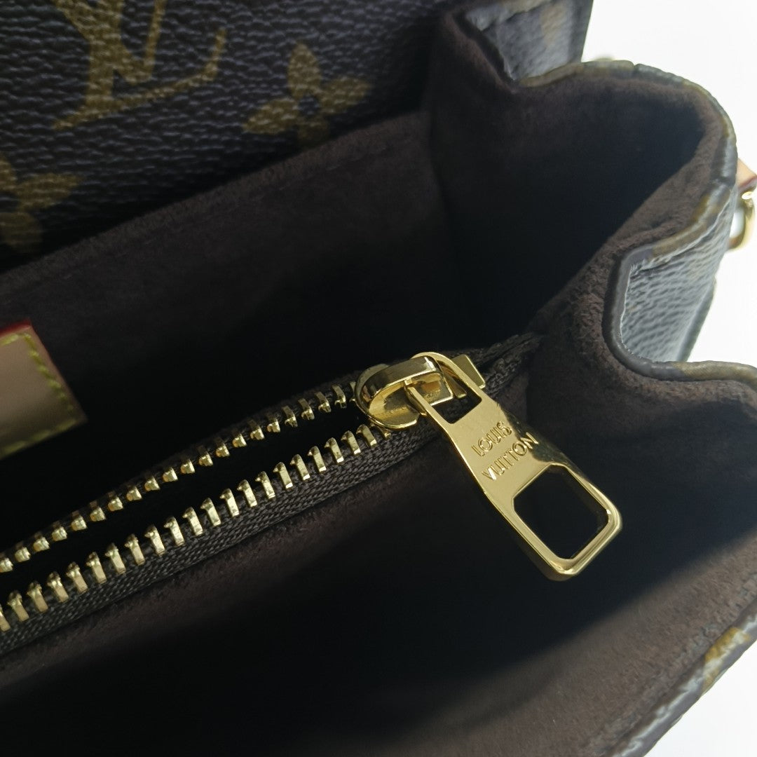 MÉTIS EAST WEST Monogram Coated Canvas Brown
