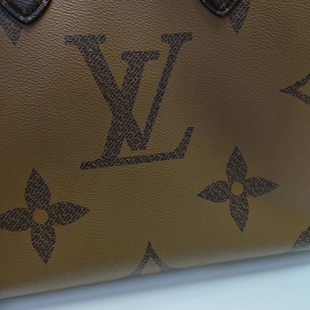 ONTHEGO MM Monogram Coated Canvas Brown