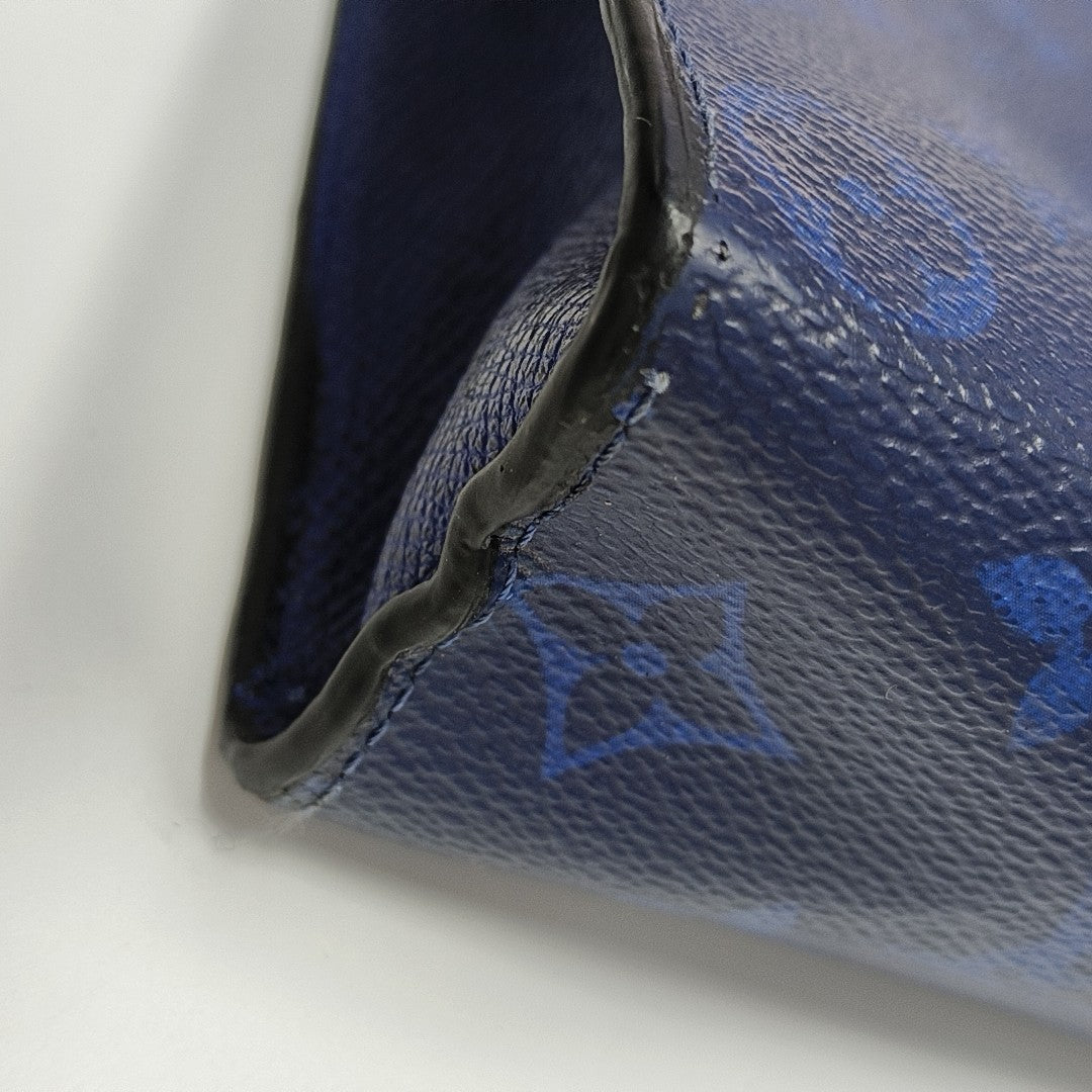 Pochette Voyag MM Monogram Coated Canvas Blue