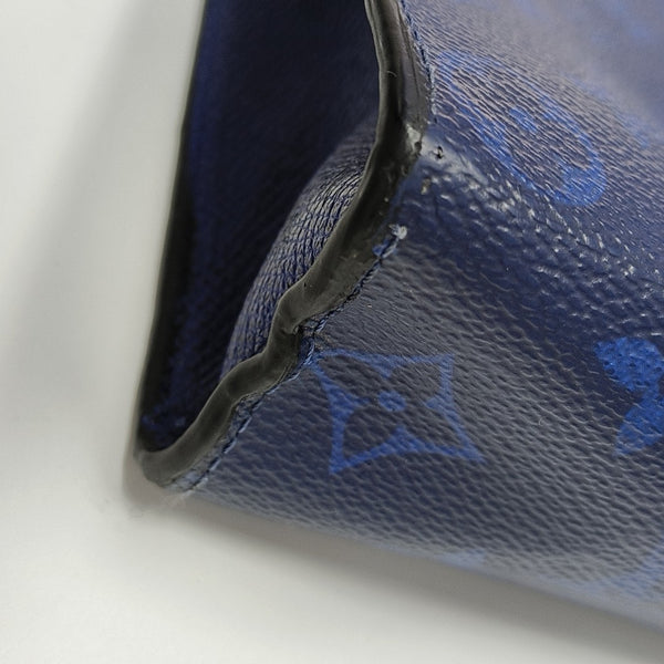 Pochette Voyag MM Monogram Coated Canvas Blue