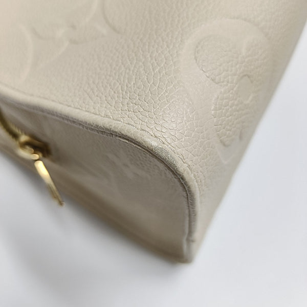 ONTHEGO EAST WEST Monogram Calfskin Beige