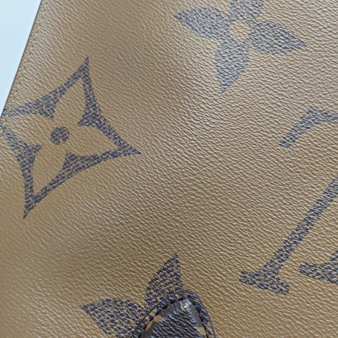 ONTHEGO MM Monogram Coated Canvas Brown