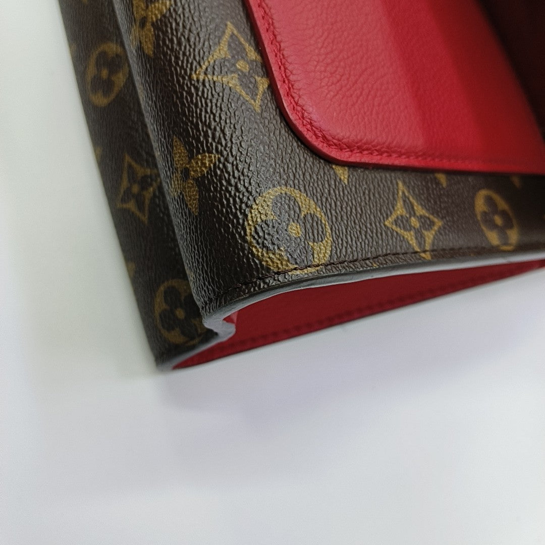 VICTOIRE Monogram Coated Canvas Brown