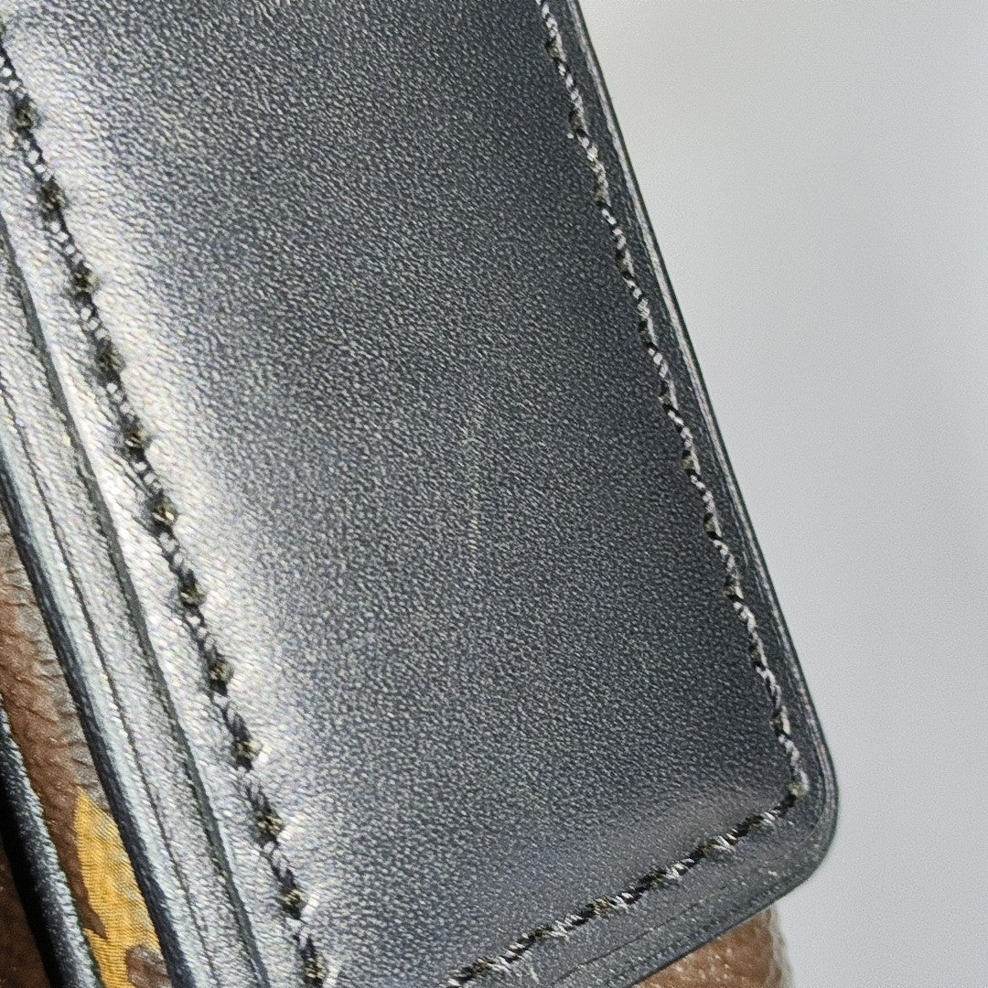 DISTRICT PM Monogram Coated Canvas Brown