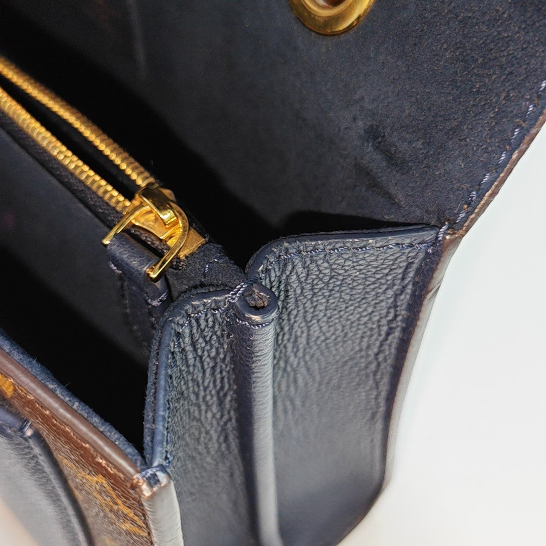 VICTOIRE Monogram Coated Canvas Brown