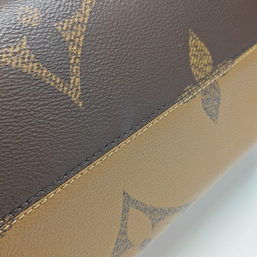 ONTHEGO MM Monogram Coated Canvas Brown