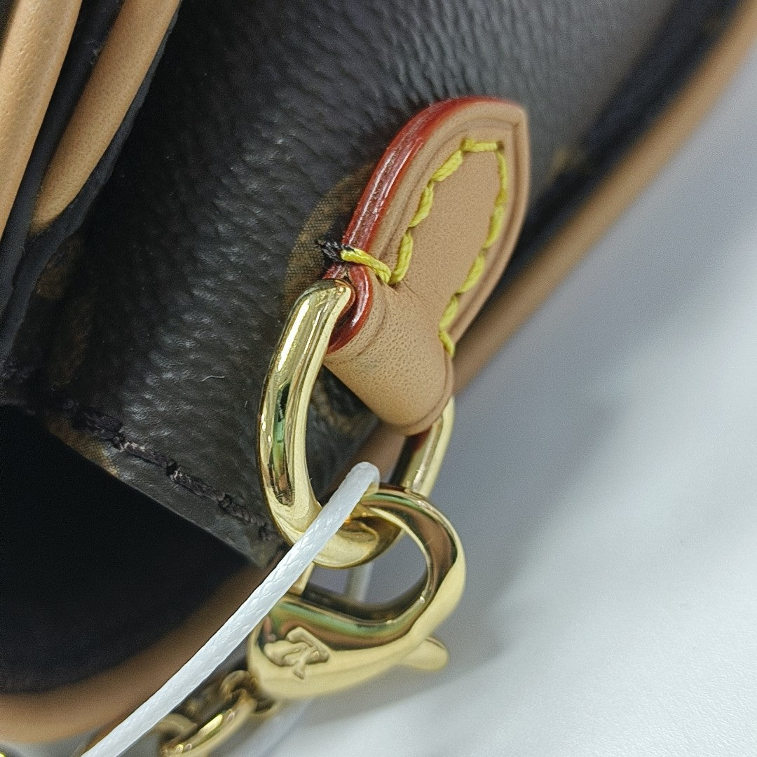 Pochette Camille Monogram Coated Canvas Brown
