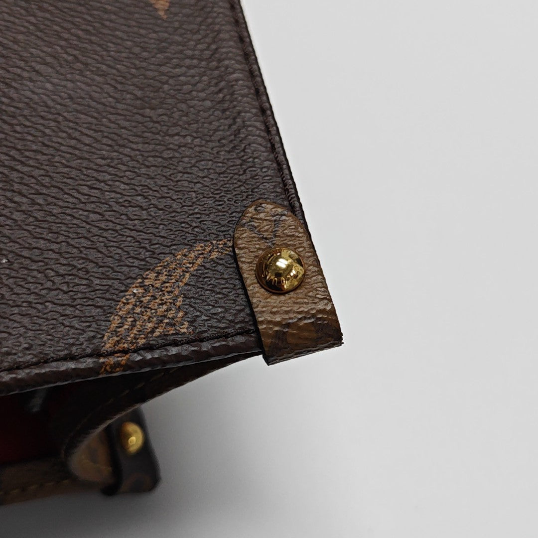 ONTHEGO PM Monogram Coated Canvas Brown