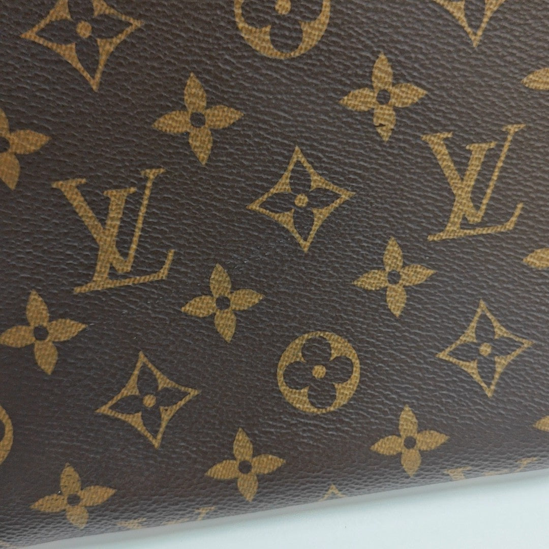 DISCOVERY GM Monogram Coated Canvas Brown