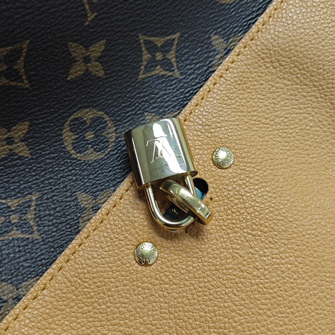 VÉNUS Monogram Coated Canvas Brown