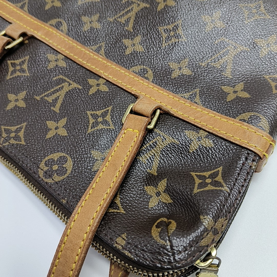 COUSSIN GM Monogram Coated Canvas Brown