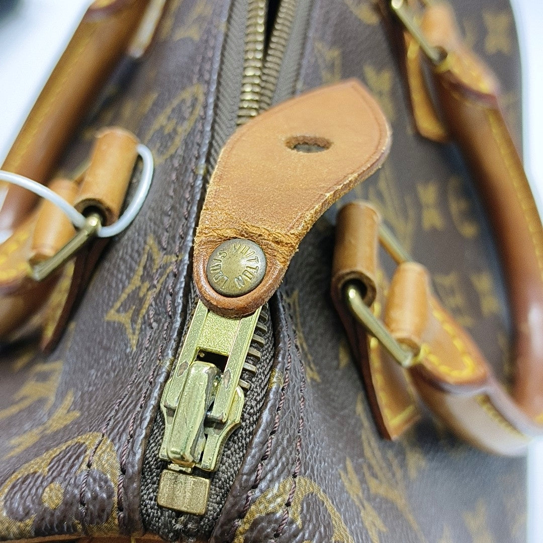 Authenticated pre-owned  SPEEDY 25 Monogram Coated Canvas Brown - Top Handle Bag at Looply