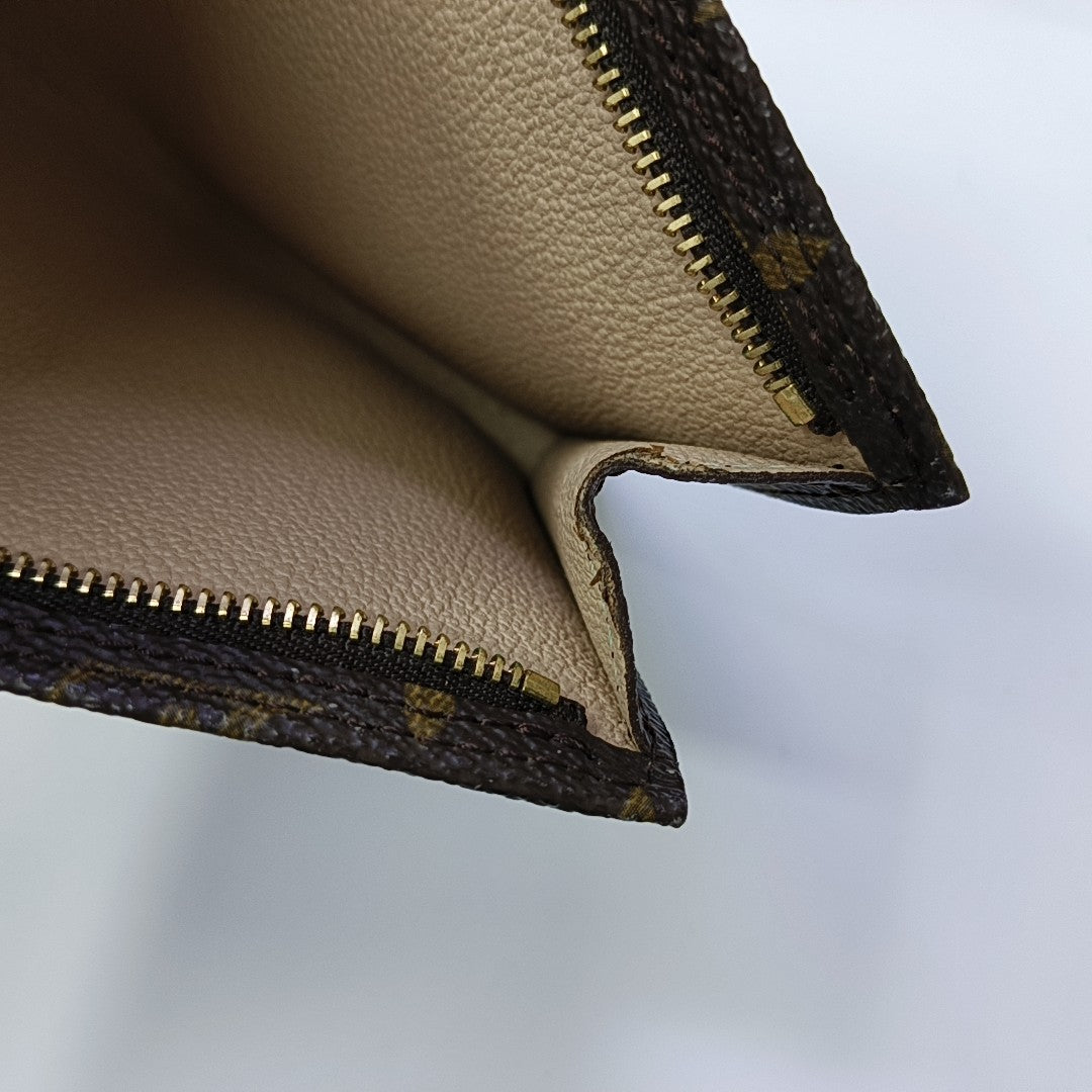 Monogram Coated Canvas Clutch Brown