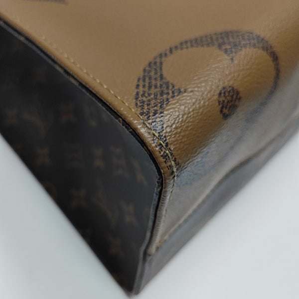 ONTHEGO MM Monogram Coated Canvas Brown