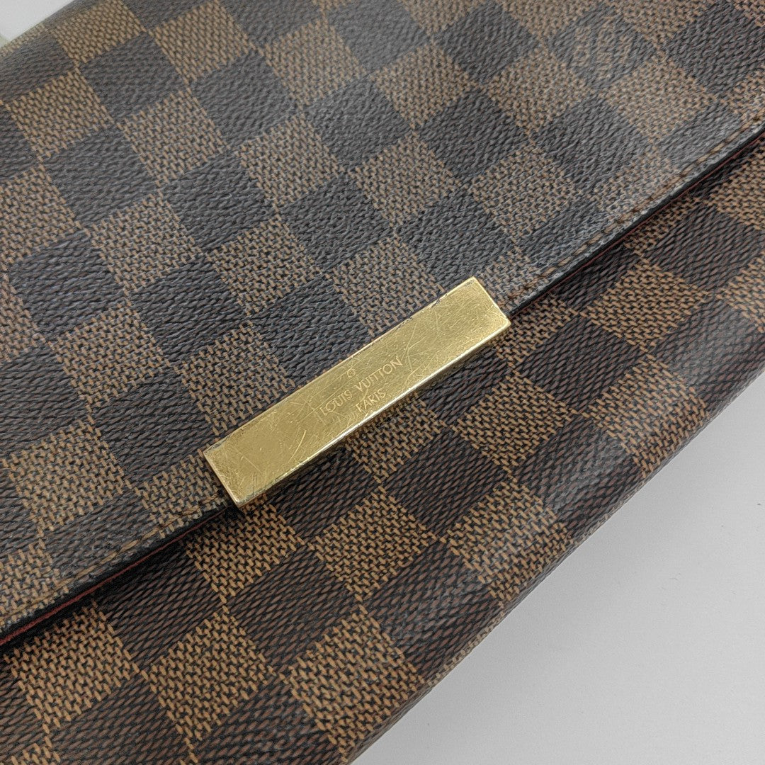 FAVORITE PM Damier Ebene Coated Canvas Brown