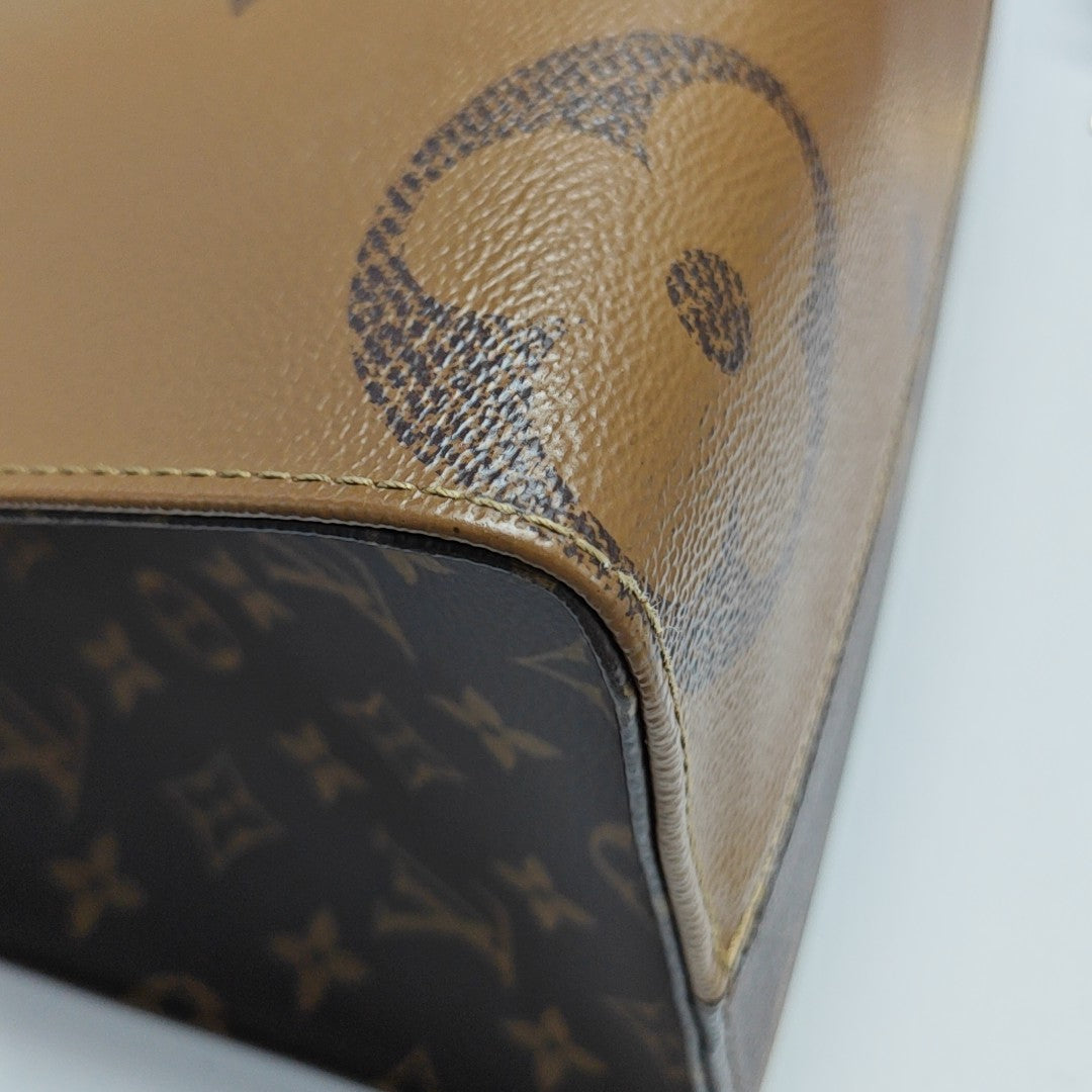 ONTHEGO MM Monogram Coated Canvas Brown