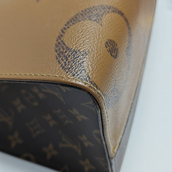 ONTHEGO MM Monogram Coated Canvas Brown