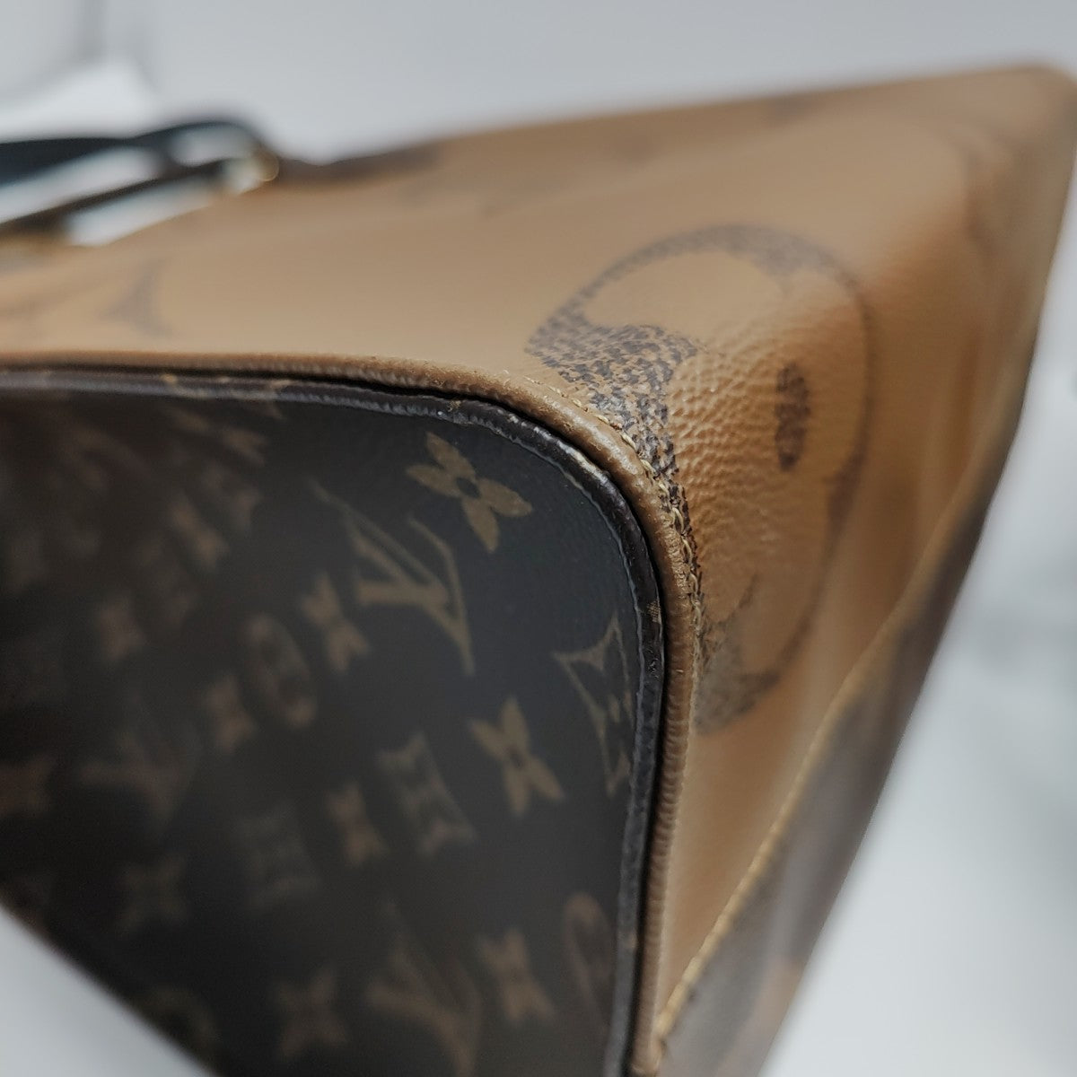 ONTHEGO MM Monogram Coated Canvas Brown