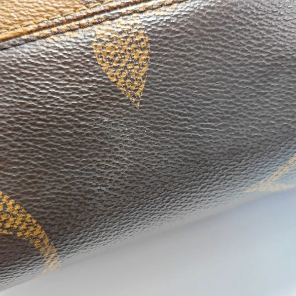 ONTHEGO MM Monogram Coated Canvas Brown