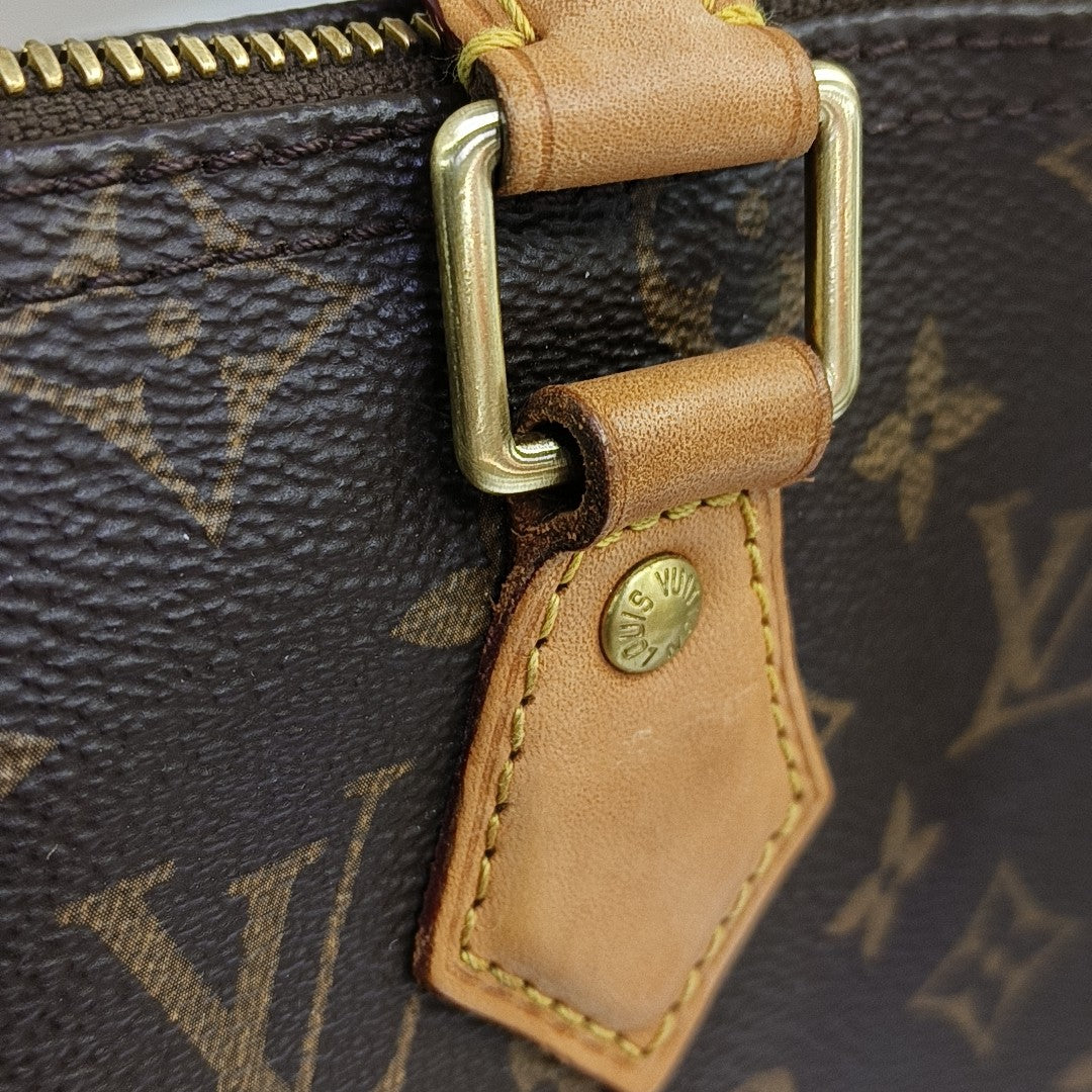 SPEEDY 25 Monogram Coated Canvas Brown
