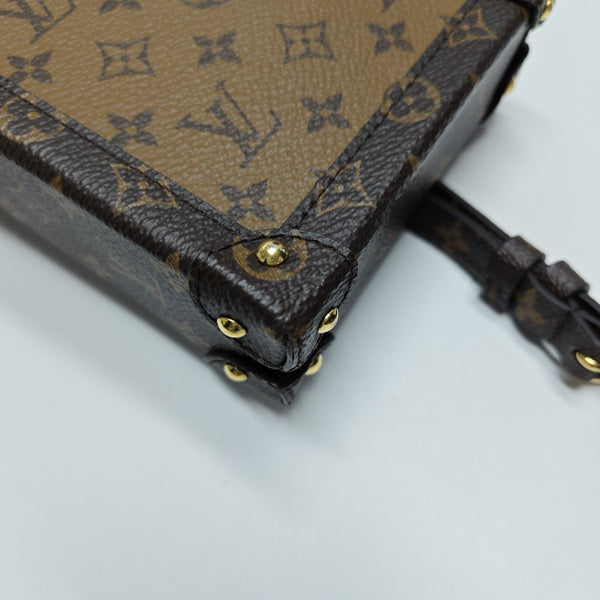 TRUNK Monogram Coated Canvas Brown