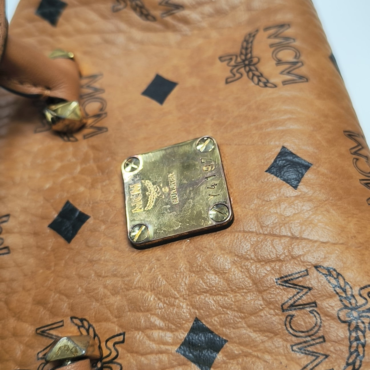 ESSENTIAL Monogram Coated Canvas Brown