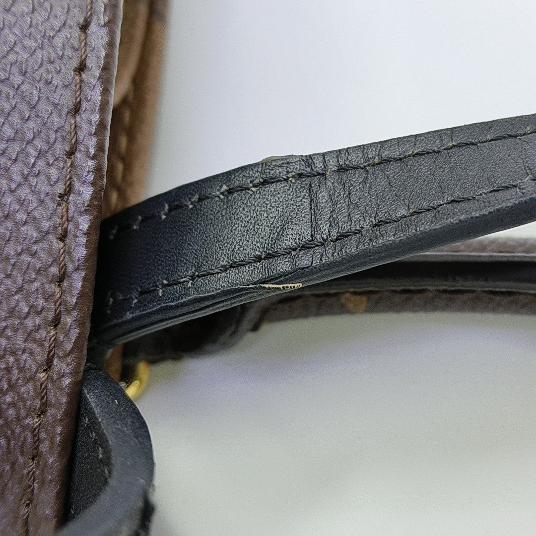 ONTHEGO MM Monogram Coated Canvas Brown