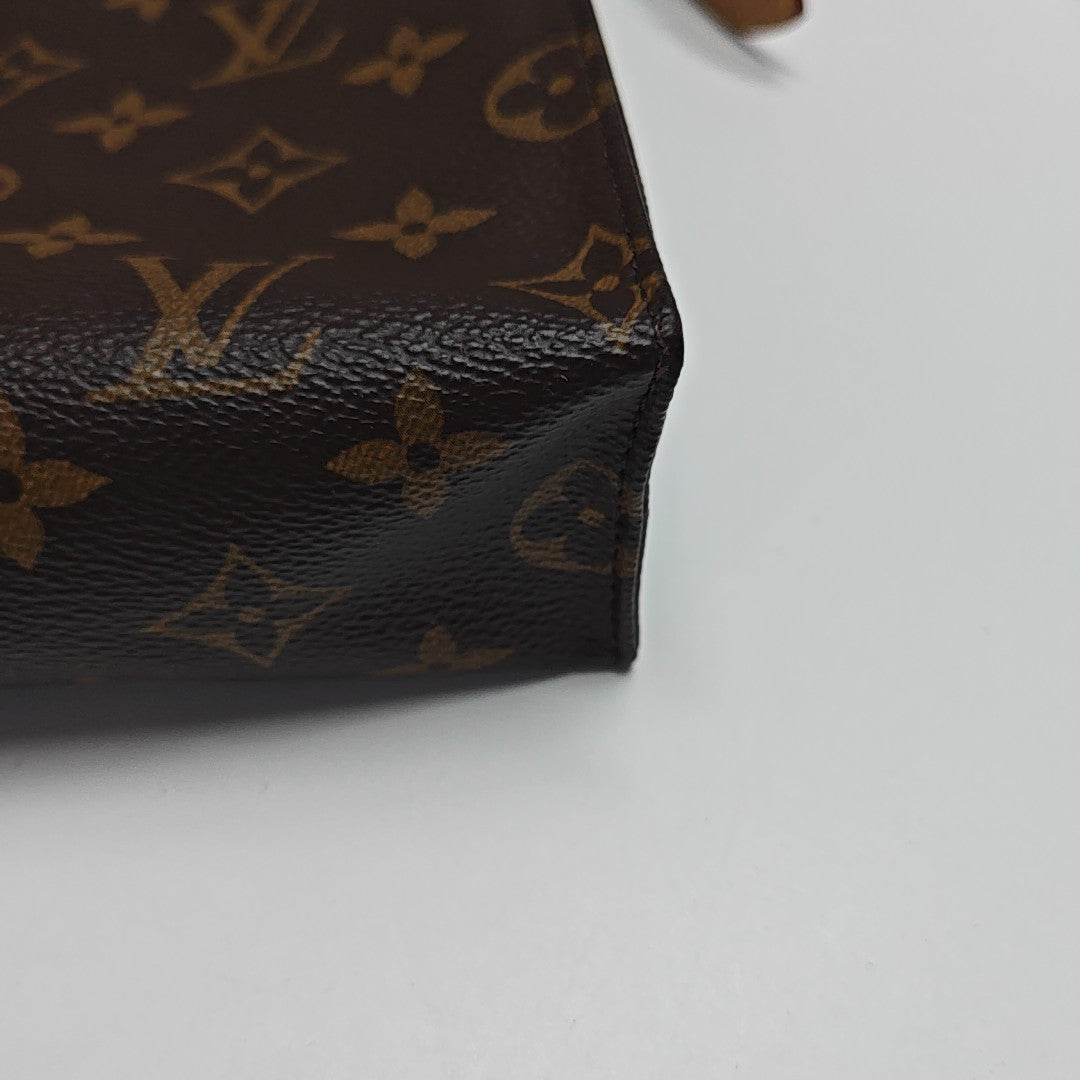 TOILET POCKET 26 Monogram Coated Canvas Brown