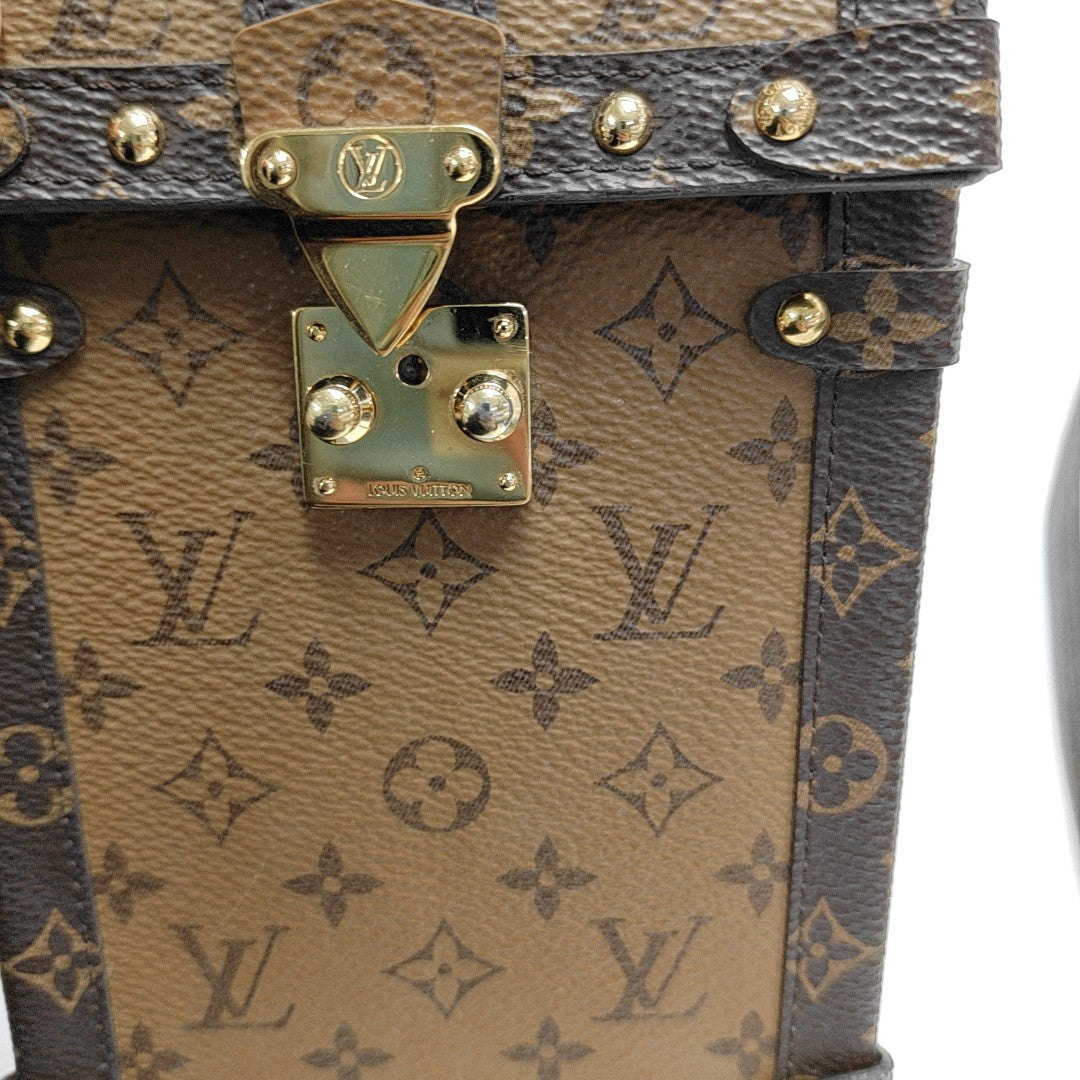 TRUNK Monogram Coated Canvas Brown