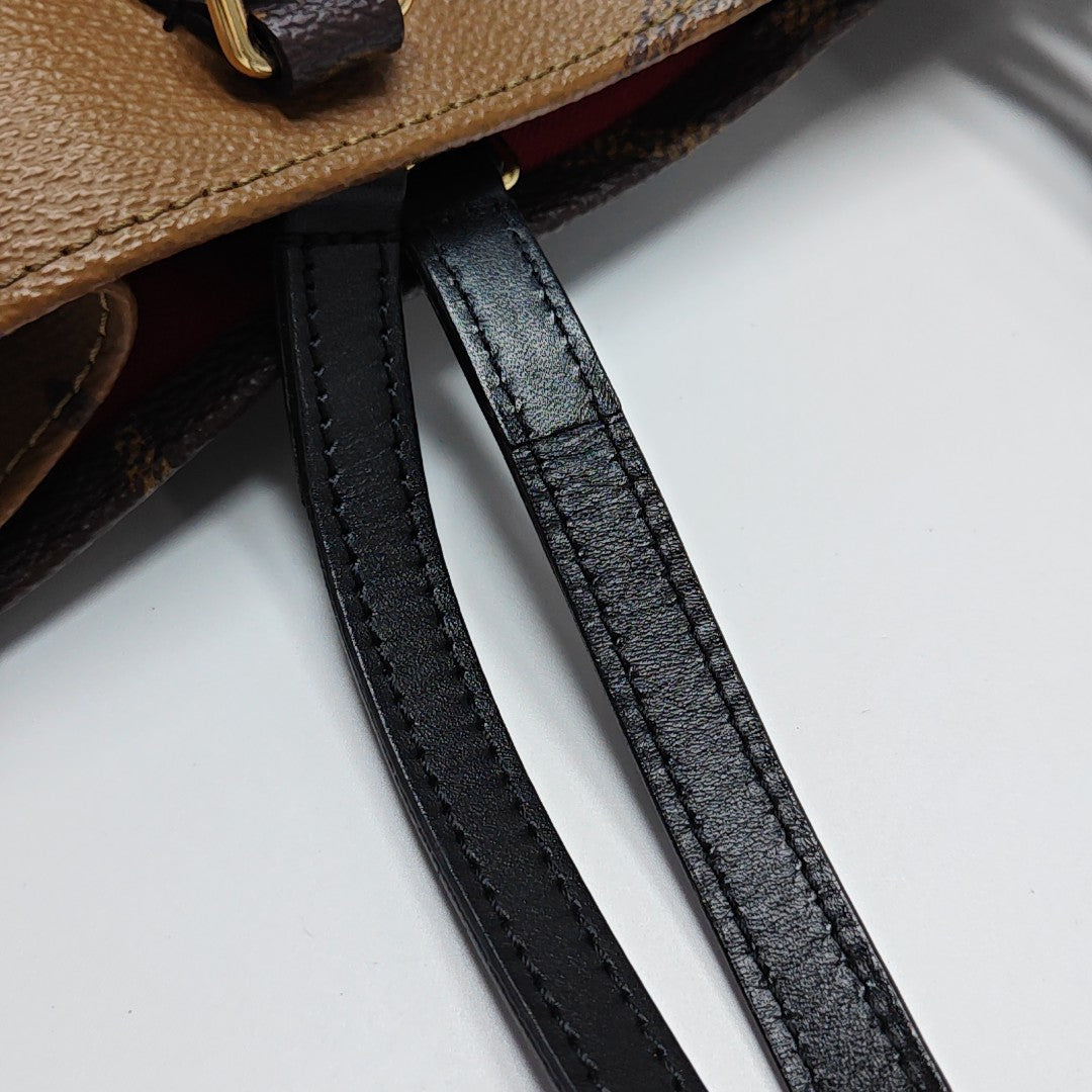 ONTHEGO MM Monogram Coated Canvas Brown