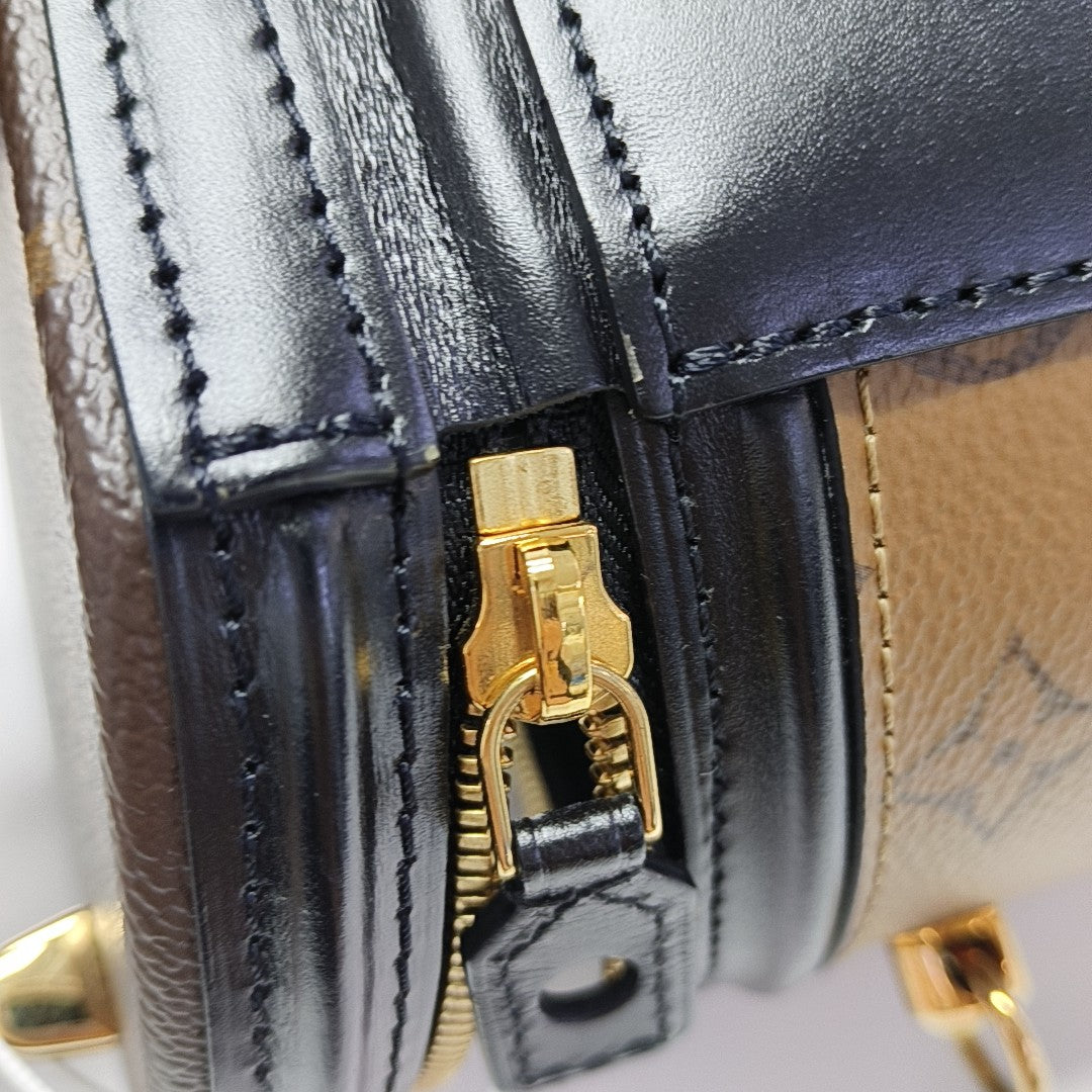 CANNES PM Monogram Coated Canvas Brown