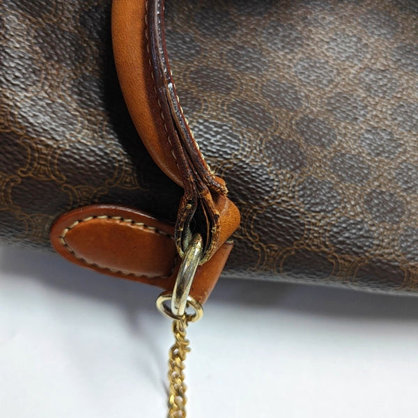 Authenticated pre-owned  MACADAM BLASON TRIOMPHE Coated Canvas Brown - Top Handle Bag at Looply