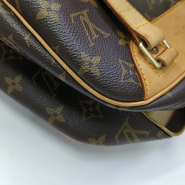 EXCURSION Monogram Coated Canvas Brown