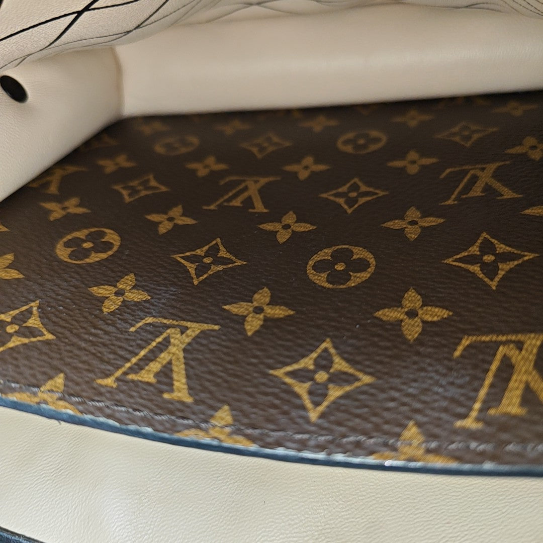 TRUNK Monogram Coated Canvas Brown
