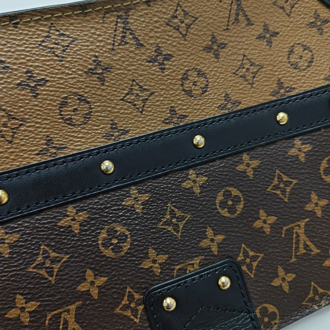 TRUNK Monogram Coated Canvas Brown