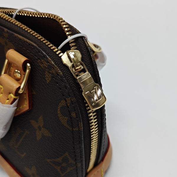 ALMA Mini Monogram Coated Canvas Brown