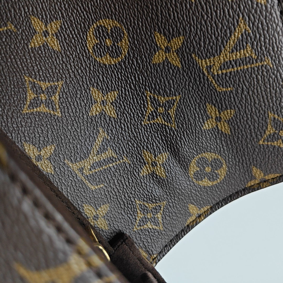 MÉTIS EAST WEST Monogram Coated Canvas Brown