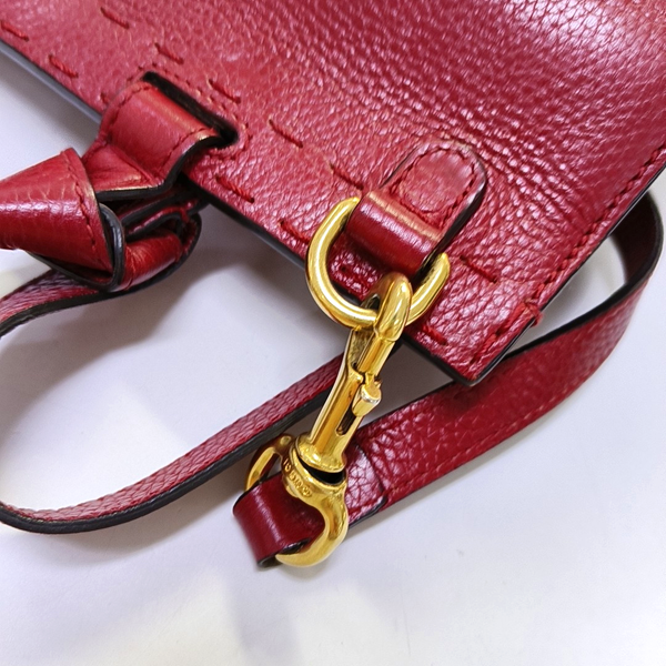 Authenticated pre-owned  GG Marmont Top Handle Small Calfskin Red - Shoulder Bag at Looply