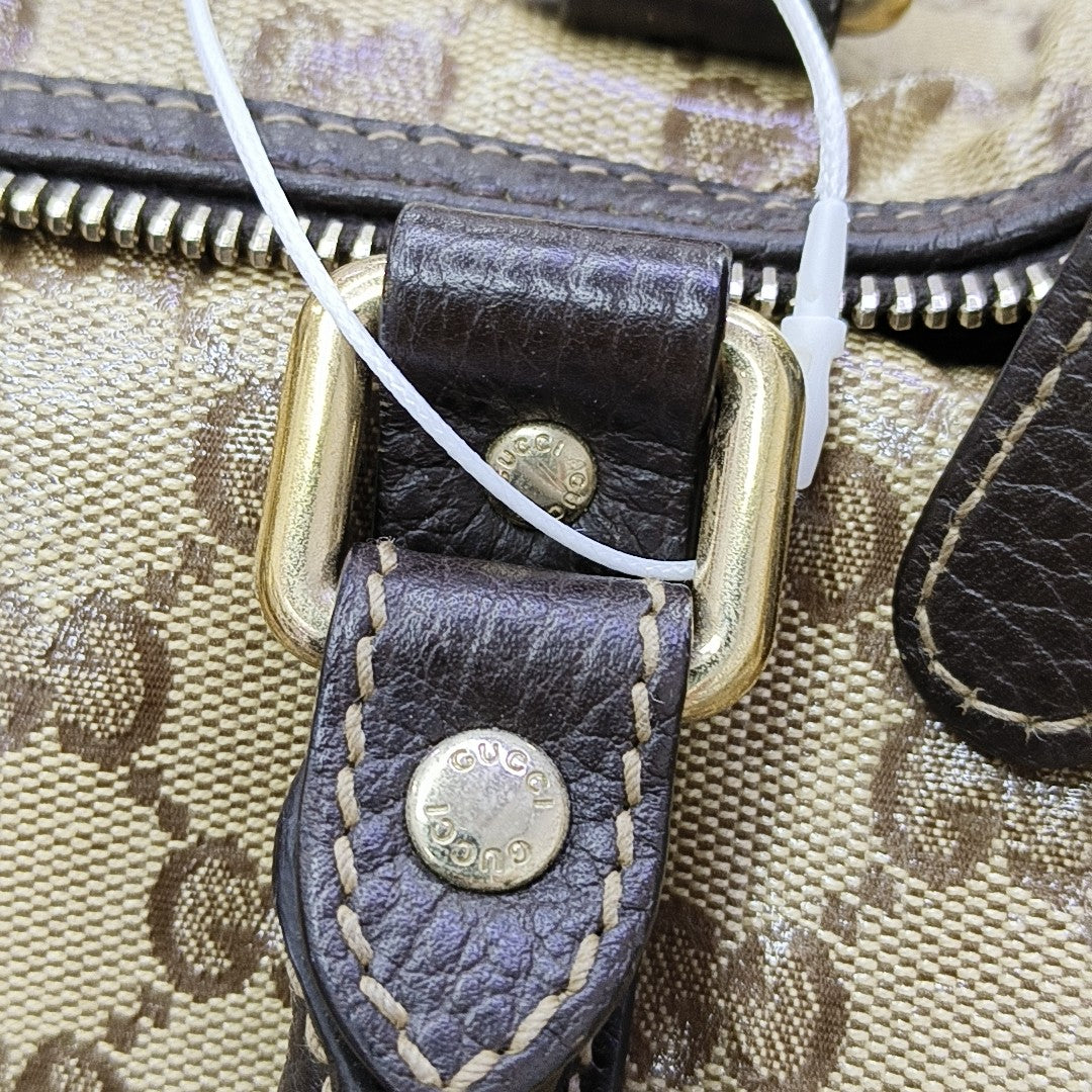 Joy Medium Monogram Coated Canvas Brown