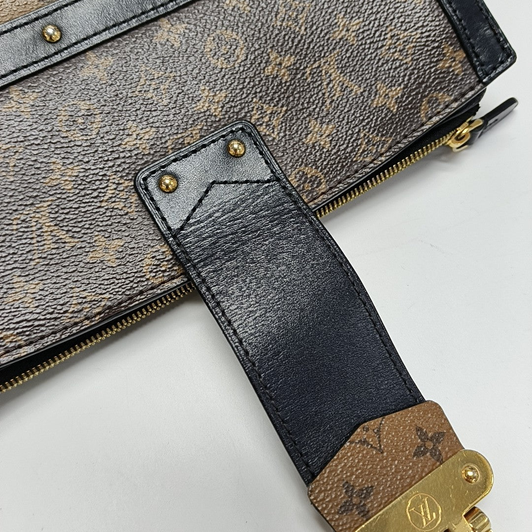 TRUNK Monogram Coated Canvas Brown