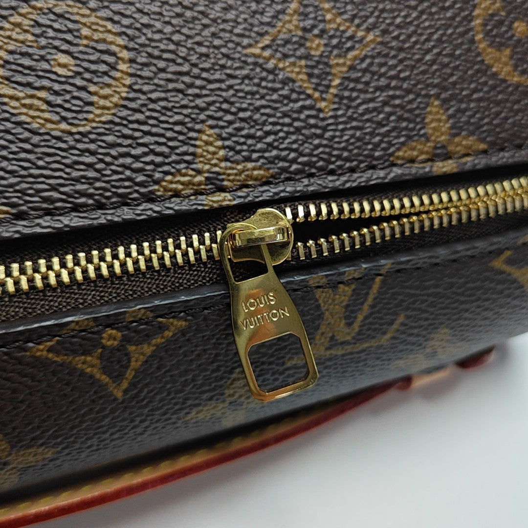 MÉTIS EAST WEST Monogram Coated Canvas Brown