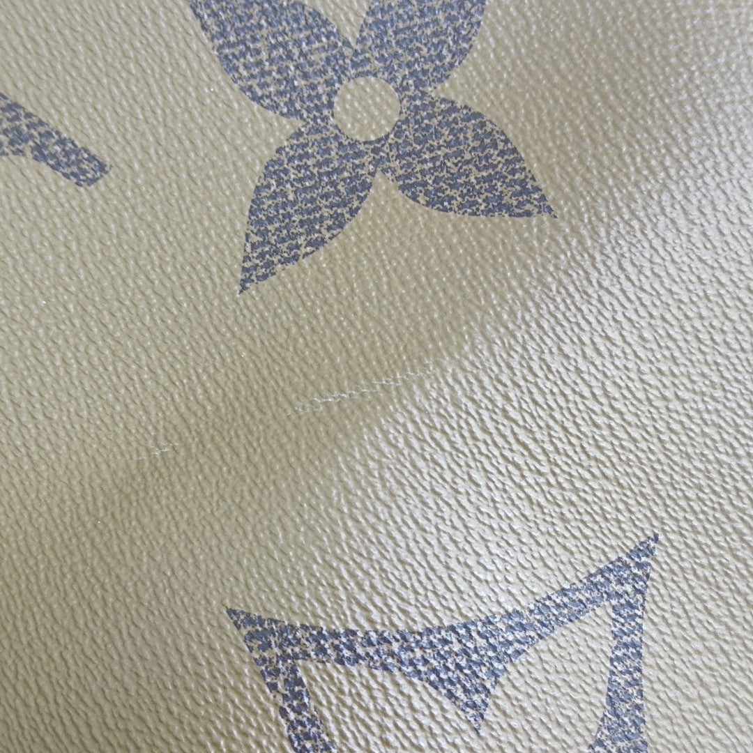ONTHEGO GM Monogram Coated Canvas Brown