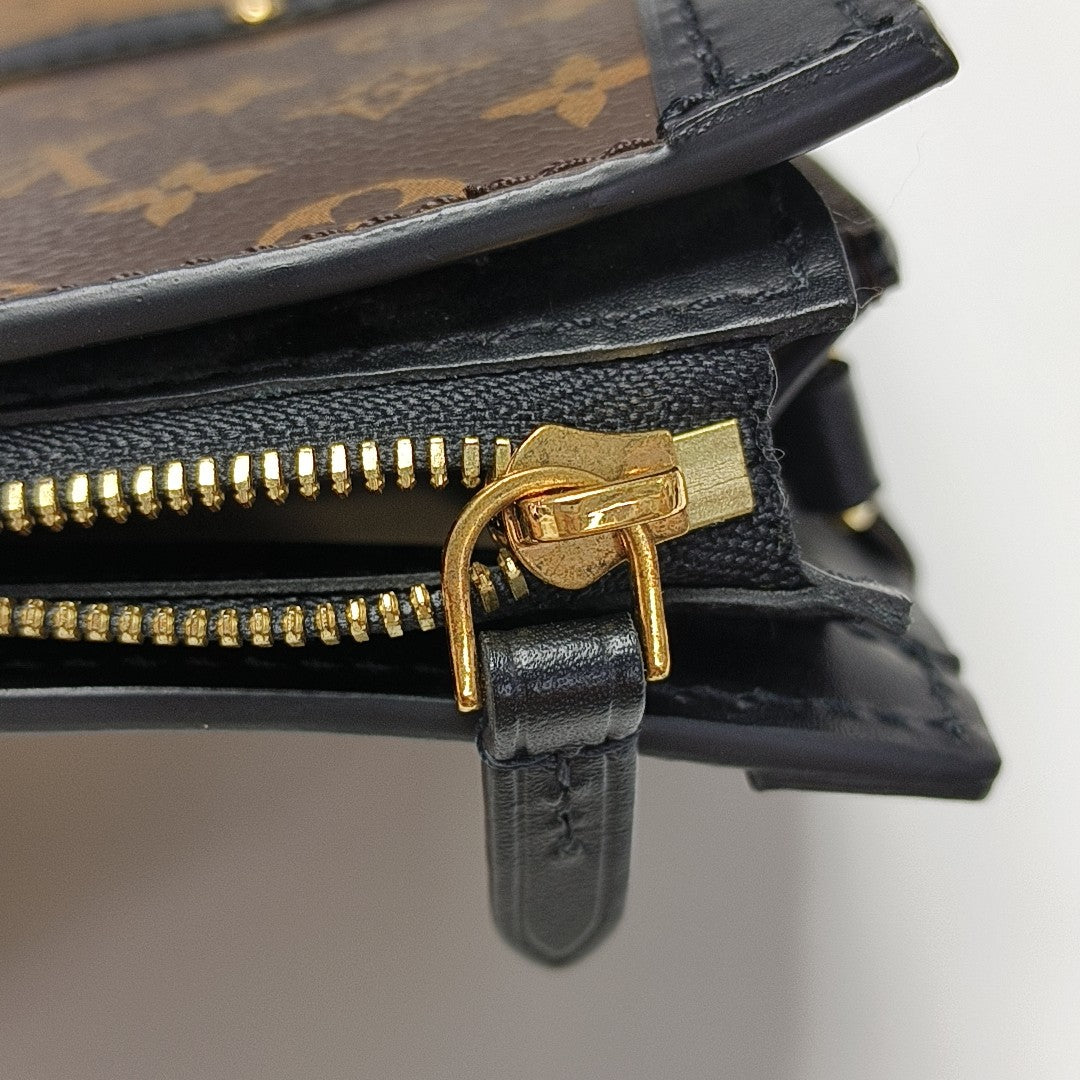 TRUNK Monogram Coated Canvas Brown